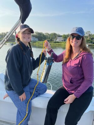 Allie and Lauren Thonus about to take water samples in Mill Pond.
